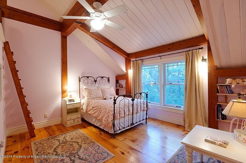 501 Greenfield Road Basalt, CO 81621 - Photo 19 of 36 a bedroom with a bed and a table