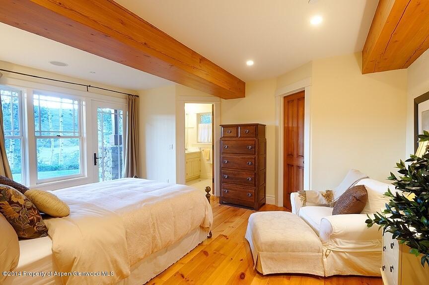 501 Greenfield Road Basalt, CO 81621 - Photo 23 of 36 a bedroom with a bed dresser and a large window