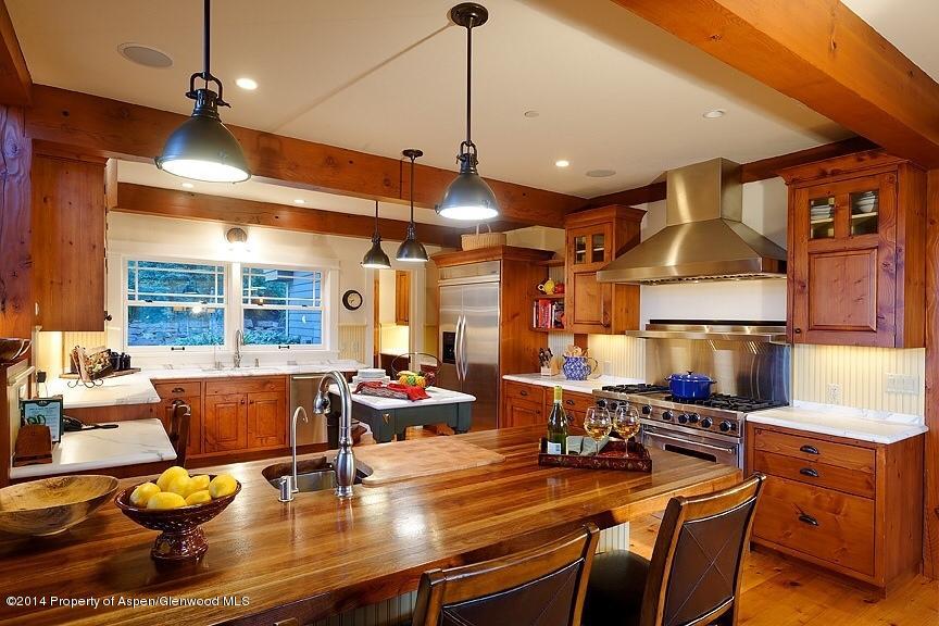 501 Greenfield Road Basalt, CO 81621 - Photo 10 of 36 a room with stainless steel appliances lots of wooden furniture