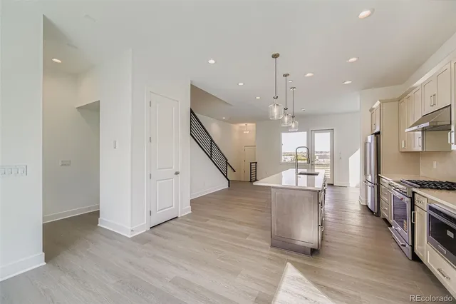 a view of kitchen with cabinets and wooden floor