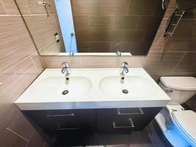 a bathroom with a sink and a toilet