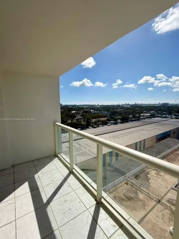 a view of an outdoor kitchen and swimming pool