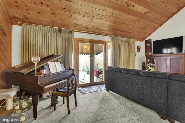 a living room with furniture fireplace and a window
