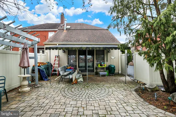 a front view of a house with sitting area