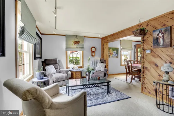 a living room with furniture or couch and a window