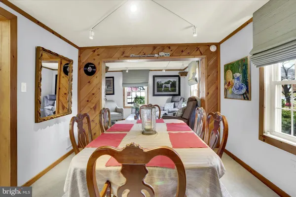 a kitchen with a sink a refrigerator and cabinets