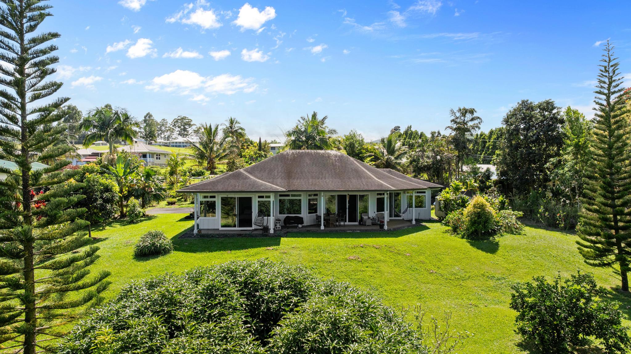 28-256 Akaka Falls Road Honomu, HI 96728 - Photo 25 of 30 a view of a house with pool and garden