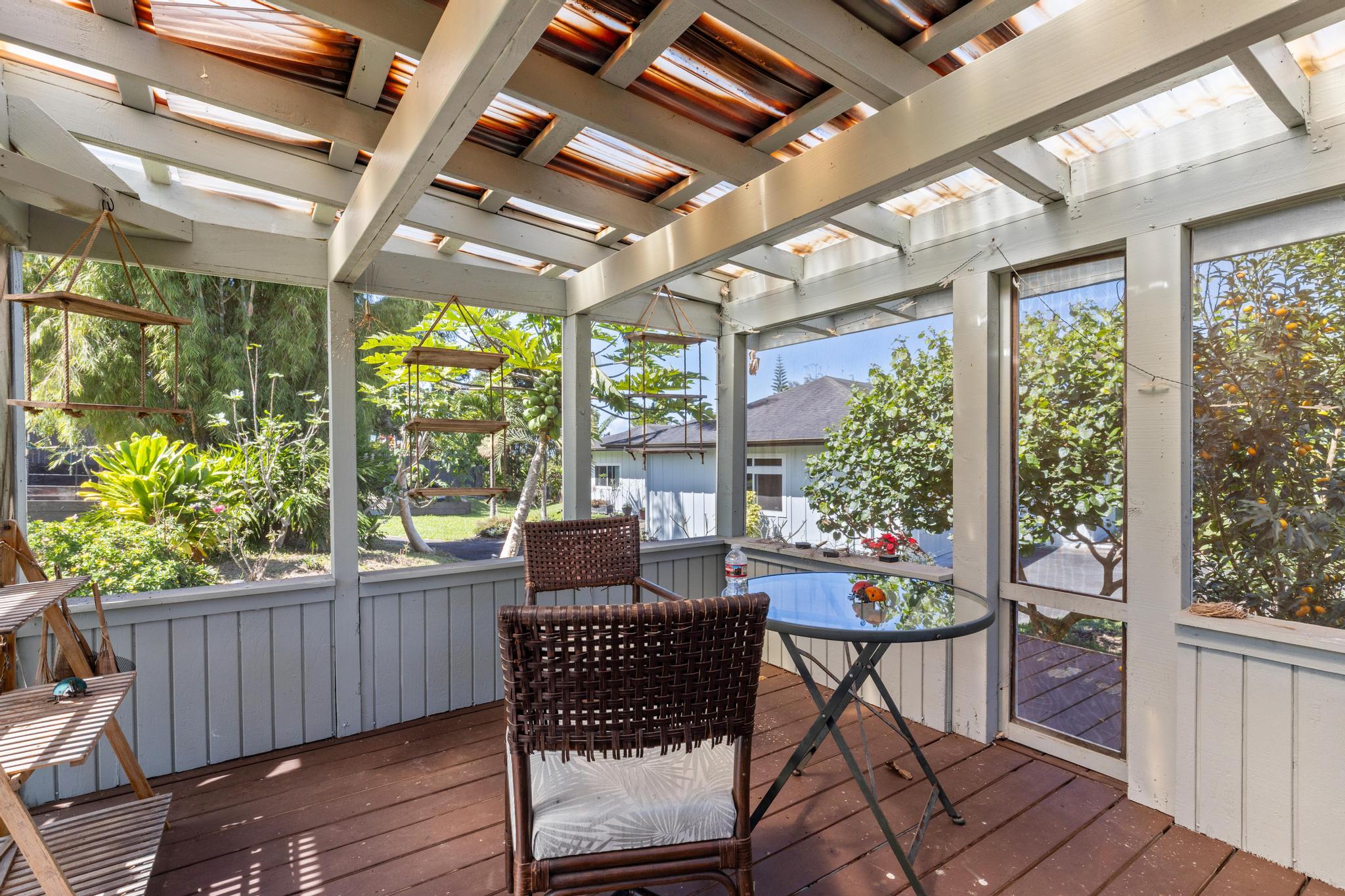 28-256 Akaka Falls Road Honomu, HI 96728 - Photo 29 of 30 a view of a patio with a table and chairs