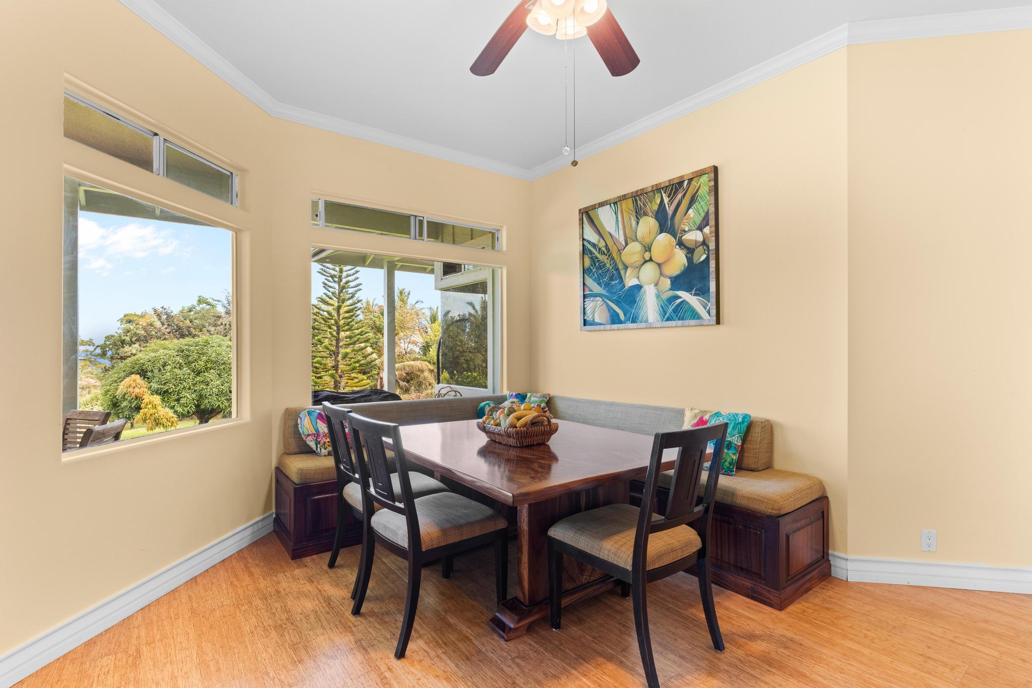 28-256 Akaka Falls Road Honomu, HI 96728 - Photo 4 of 30 a dining room with furniture a rug and wooden floor