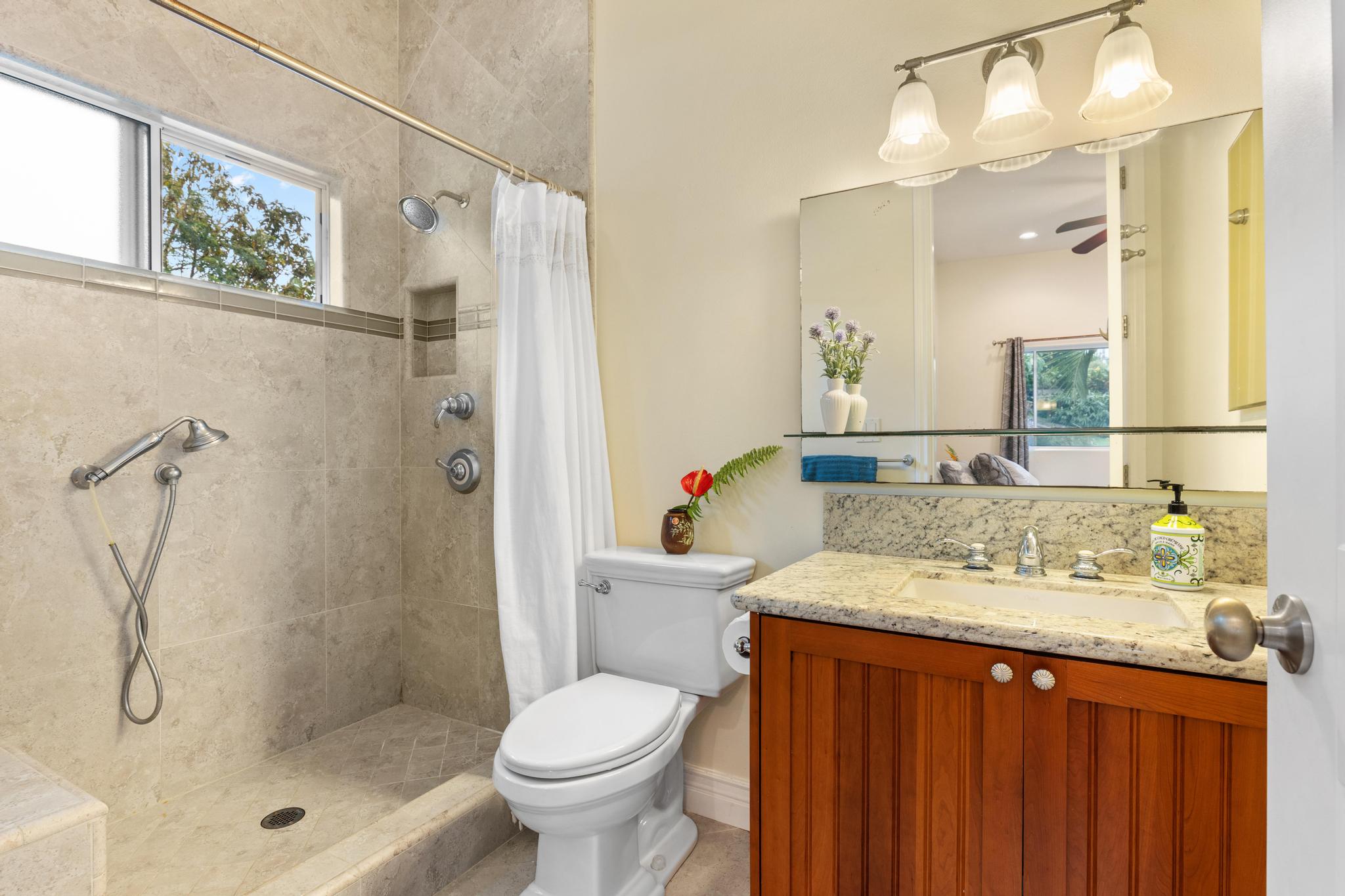 28-256 Akaka Falls Road Honomu, HI 96728 - Photo 10 of 30 a bathroom with a granite countertop sink toilet and shower