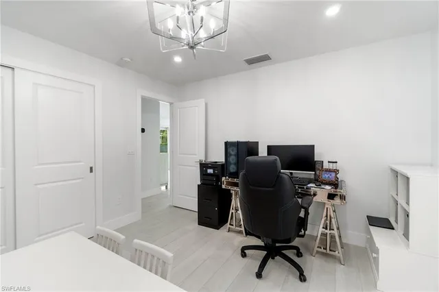 a view of a workspace with furniture