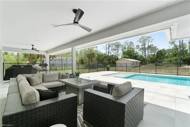 a view of a livingroom with furniture and garden