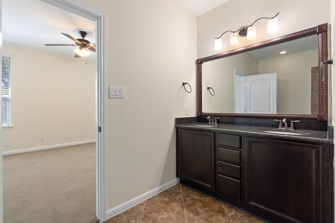 9412 Solana Vista Loop, Unit B Austin, TX 78750 - Photo 11 of 25 a bathroom with a sink and a mirror