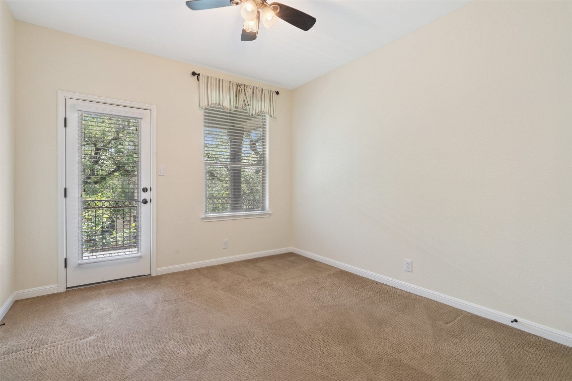 9412 Solana Vista Loop, Unit B Austin, TX 78750 - Photo 14 of 25 an empty room with a empty space and a window