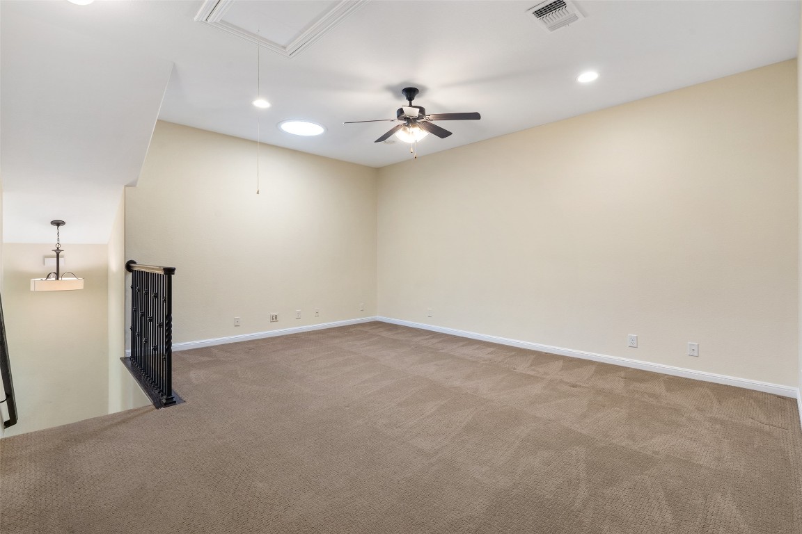 9412 Solana Vista Loop, Unit B Austin, TX 78750 - Photo 16 of 25 an empty room with a ceiling fan and a window