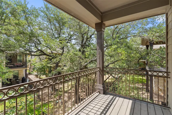 a view of balcony with wooden floor