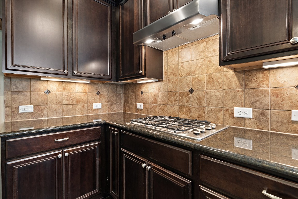 9412 Solana Vista Loop, Unit B Austin, TX 78750 - Photo 7 of 25 a kitchen with granite countertop a stove and a sink