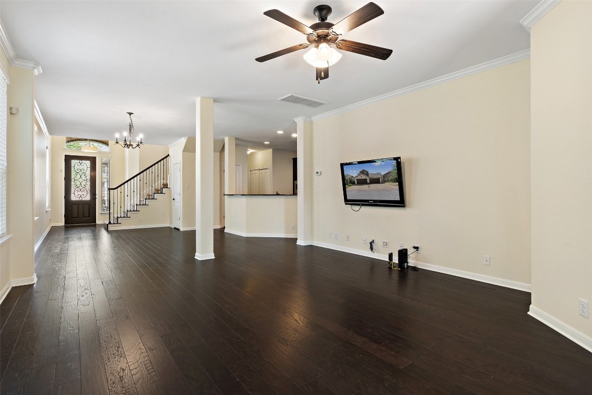 9412 Solana Vista Loop, Unit B Austin, TX 78750 - Photo 8 of 25 a view of a room with wooden floor and white walls