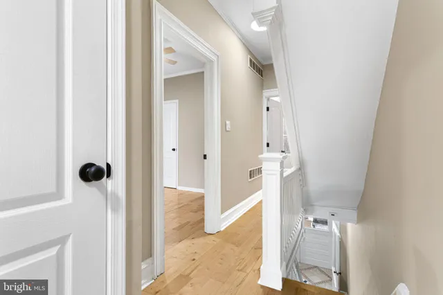 a view of a bathroom from a hallway