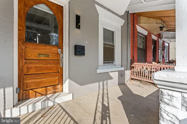a balcony with table and chairs