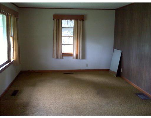 187 West Main Street Milo, ME 04463 - Photo 8 of 12 Living Room. Living room is much...
