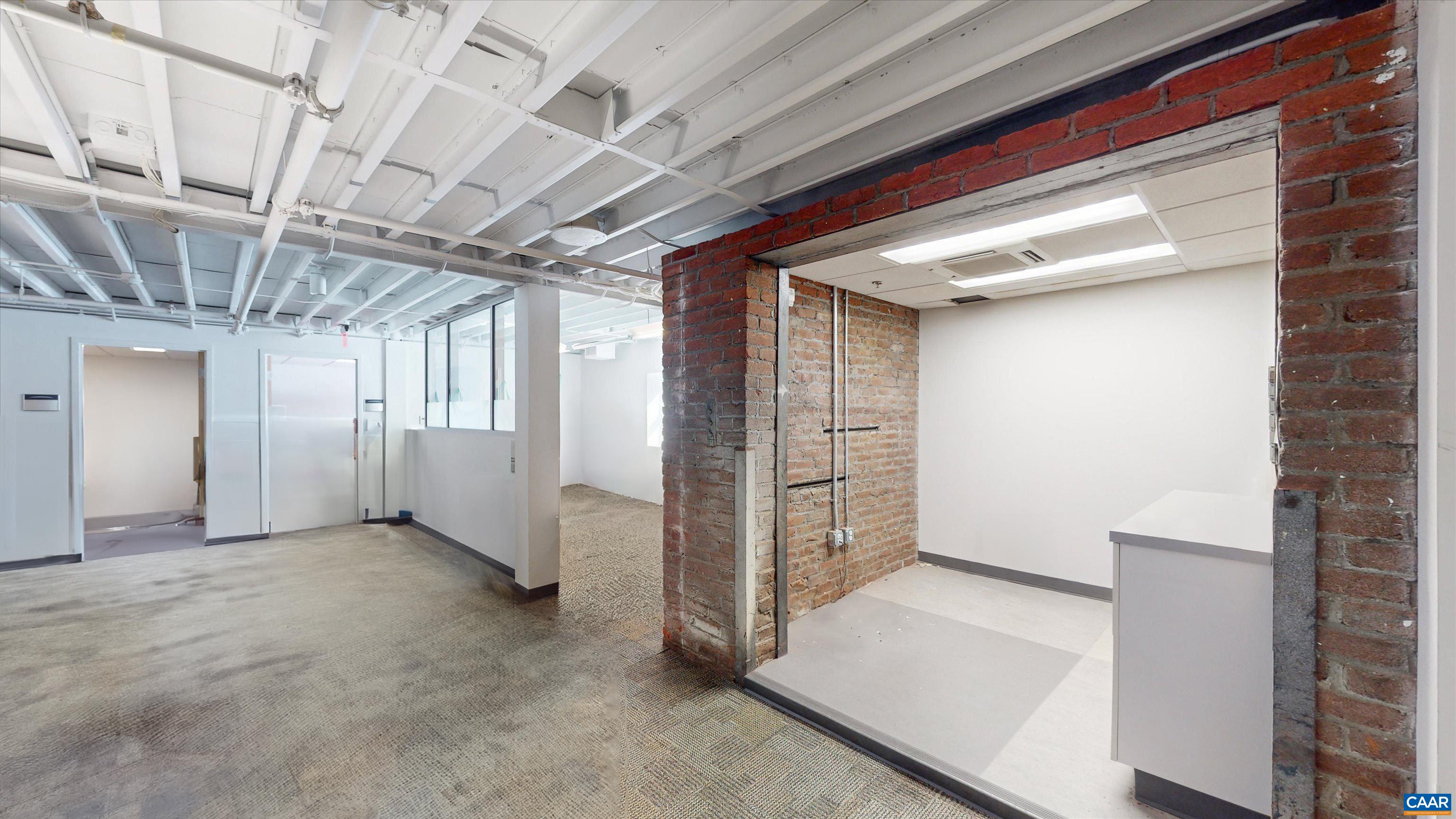 218 West Water Street Charlottesville, VA 22902 - Photo 13 of 16 a view of a hallway with staircase