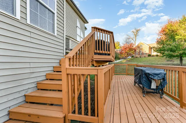 a view of entryway with wooden floor and fence