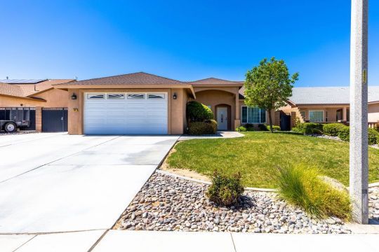 409 Acacia Street Ridgecrest, CA 93555 - Photo 3 of 34 a view of a house with a yard
