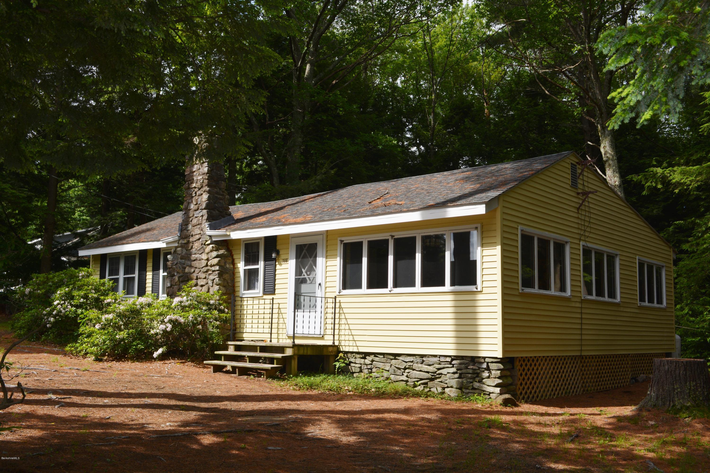 386 Pine Road Otis, MA 01029 - Photo 1 of 12 a front view of a house with a yard