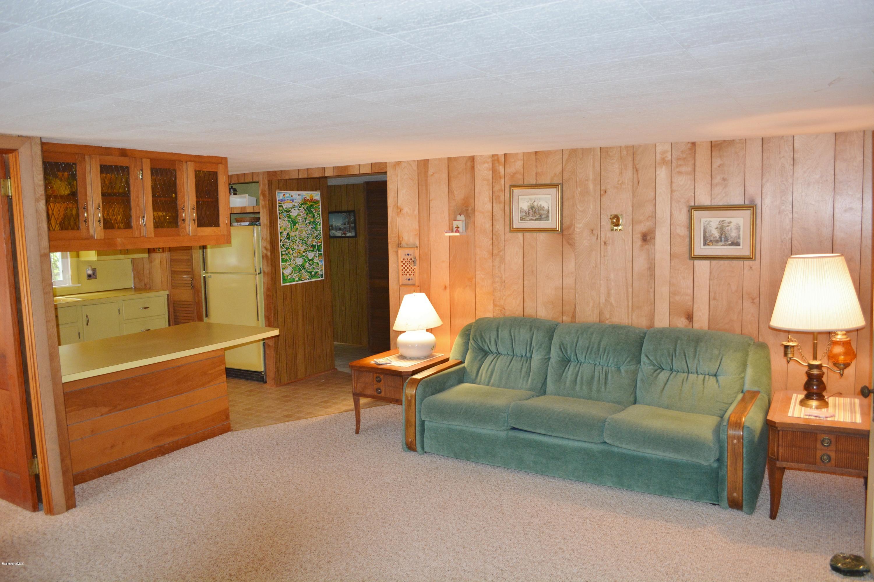 386 Pine Road Otis, MA 01029 - Photo 3 of 12 a living room with furniture and a lamp