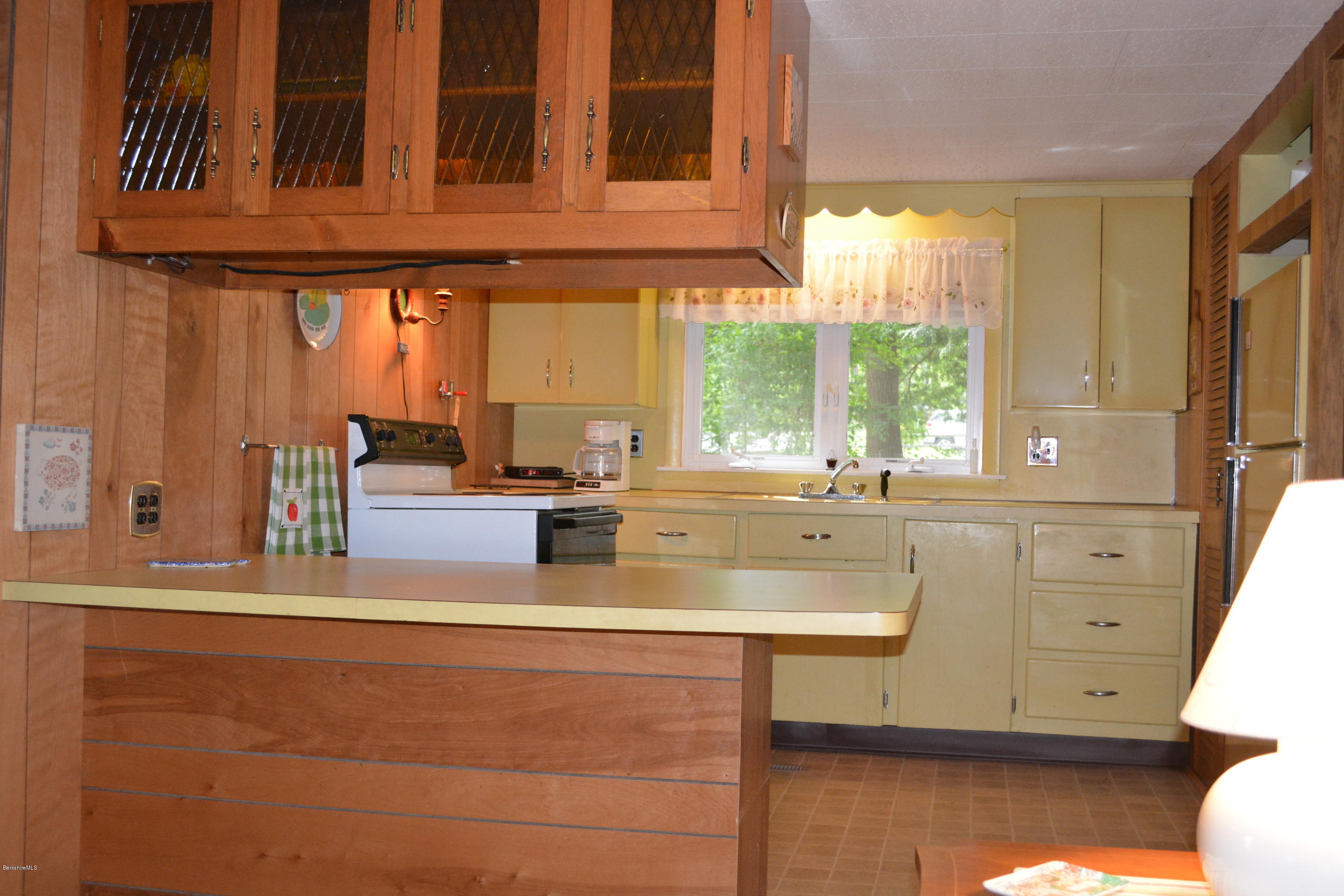 386 Pine Road Otis, MA 01029 - Photo 4 of 12 a view of a kitchen counter top space with a sink