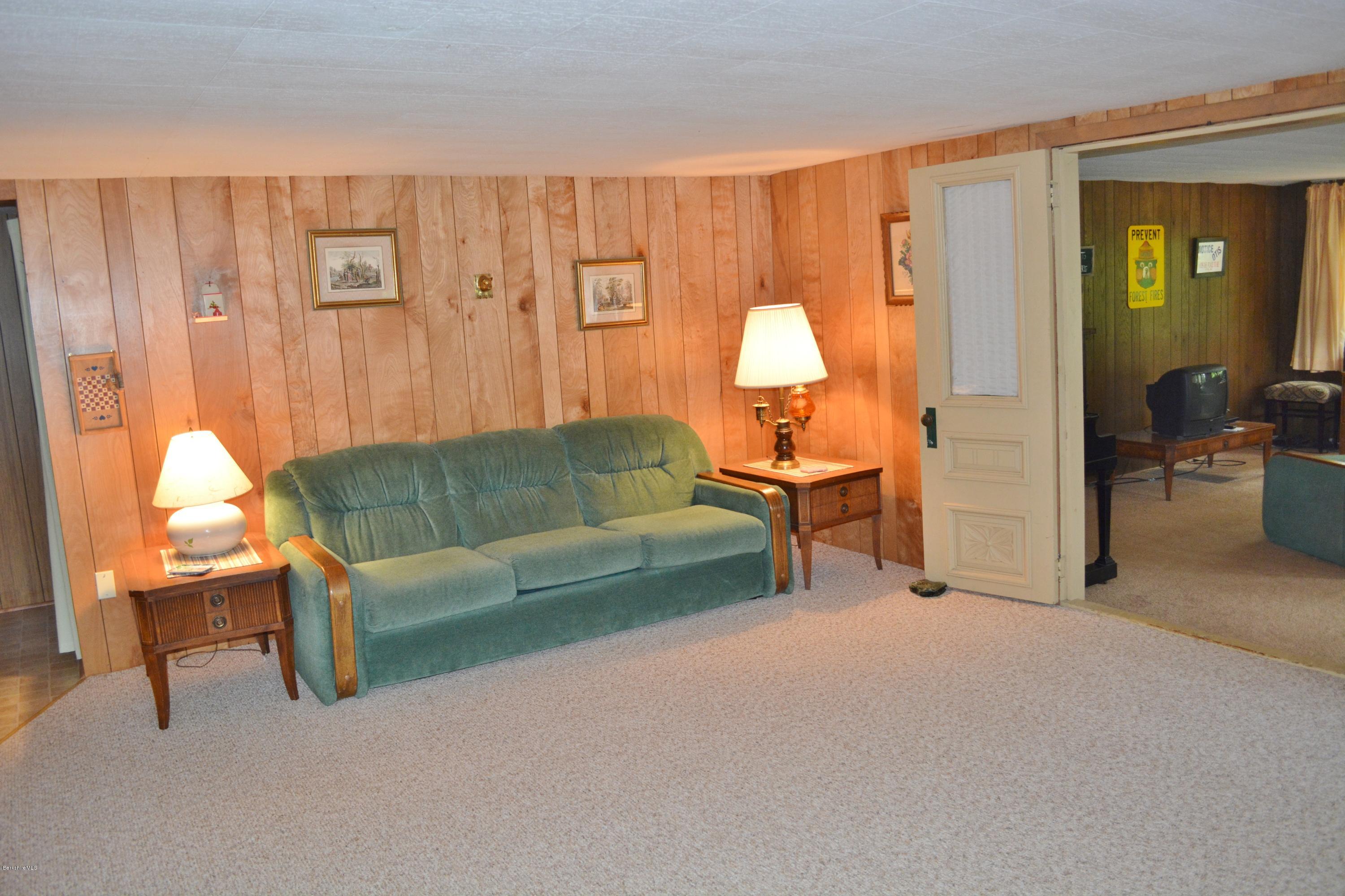 386 Pine Road Otis, MA 01029 - Photo 6 of 12 a living room with furniture and a lamp