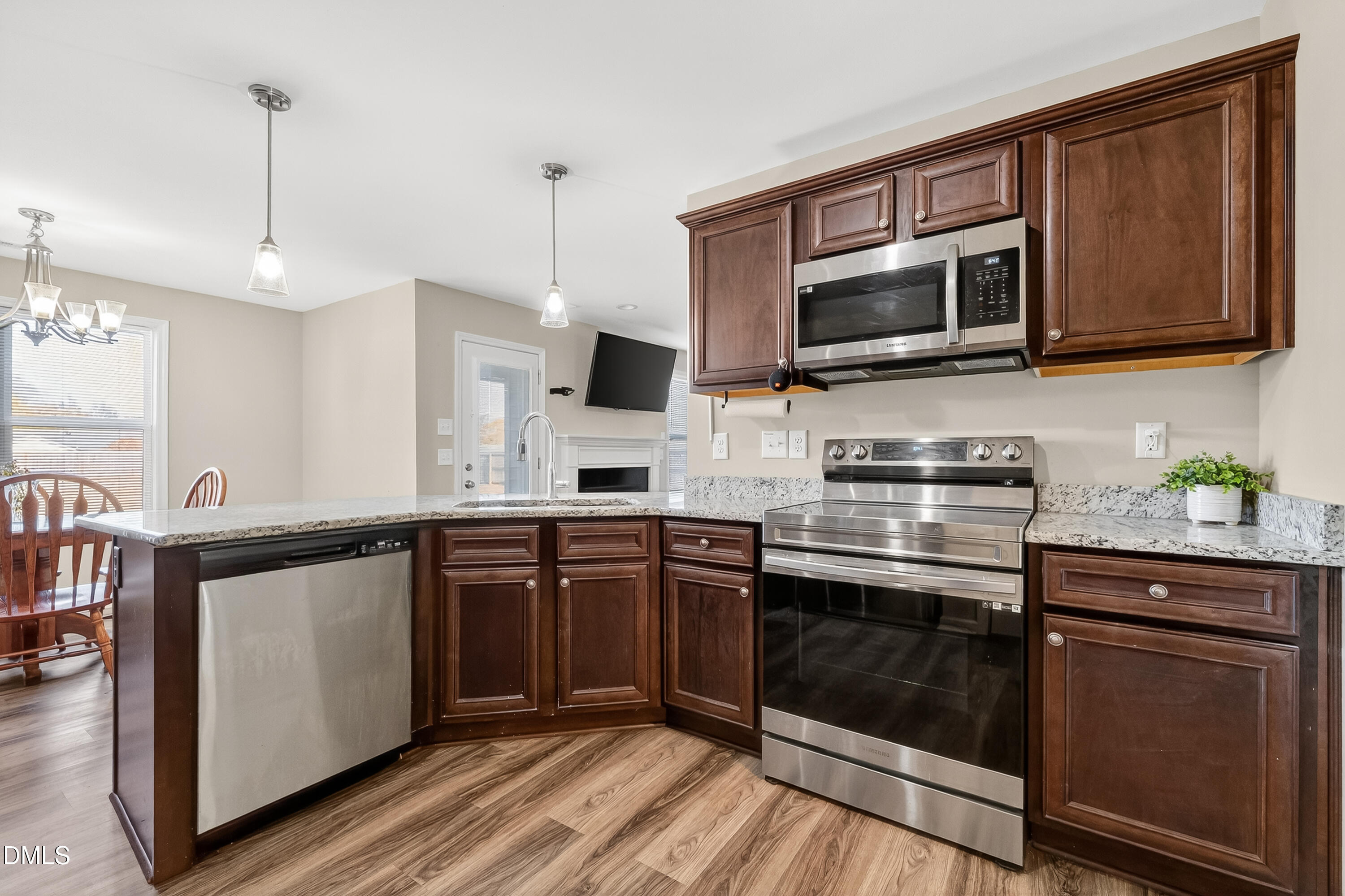 79 Ramble Falls Lane Erwin, NC 28339 - Photo 17 of 46 a kitchen with stainless steel appliances granite countertop a stove microwave and sink
