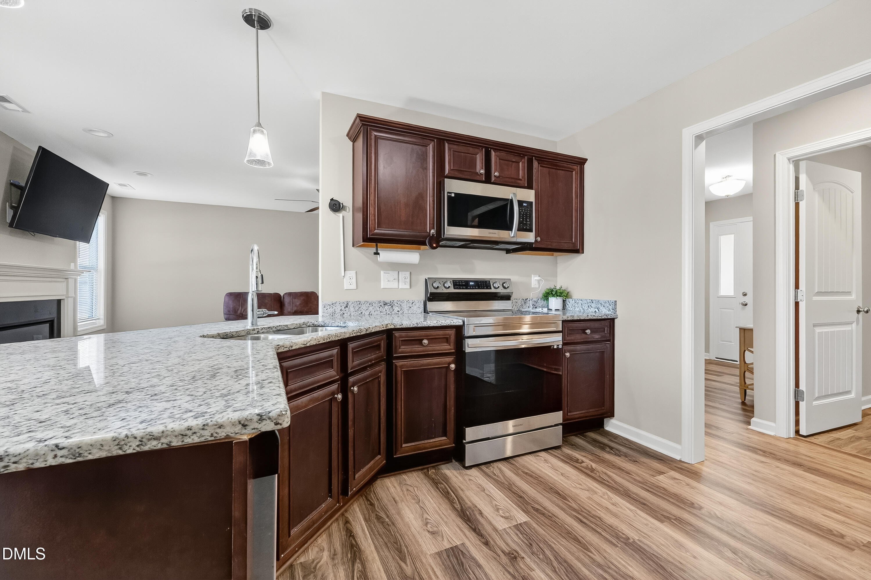 79 Ramble Falls Lane Erwin, NC 28339 - Photo 18 of 46 a kitchen with stainless steel appliances granite countertop a stove a sink and a microwave