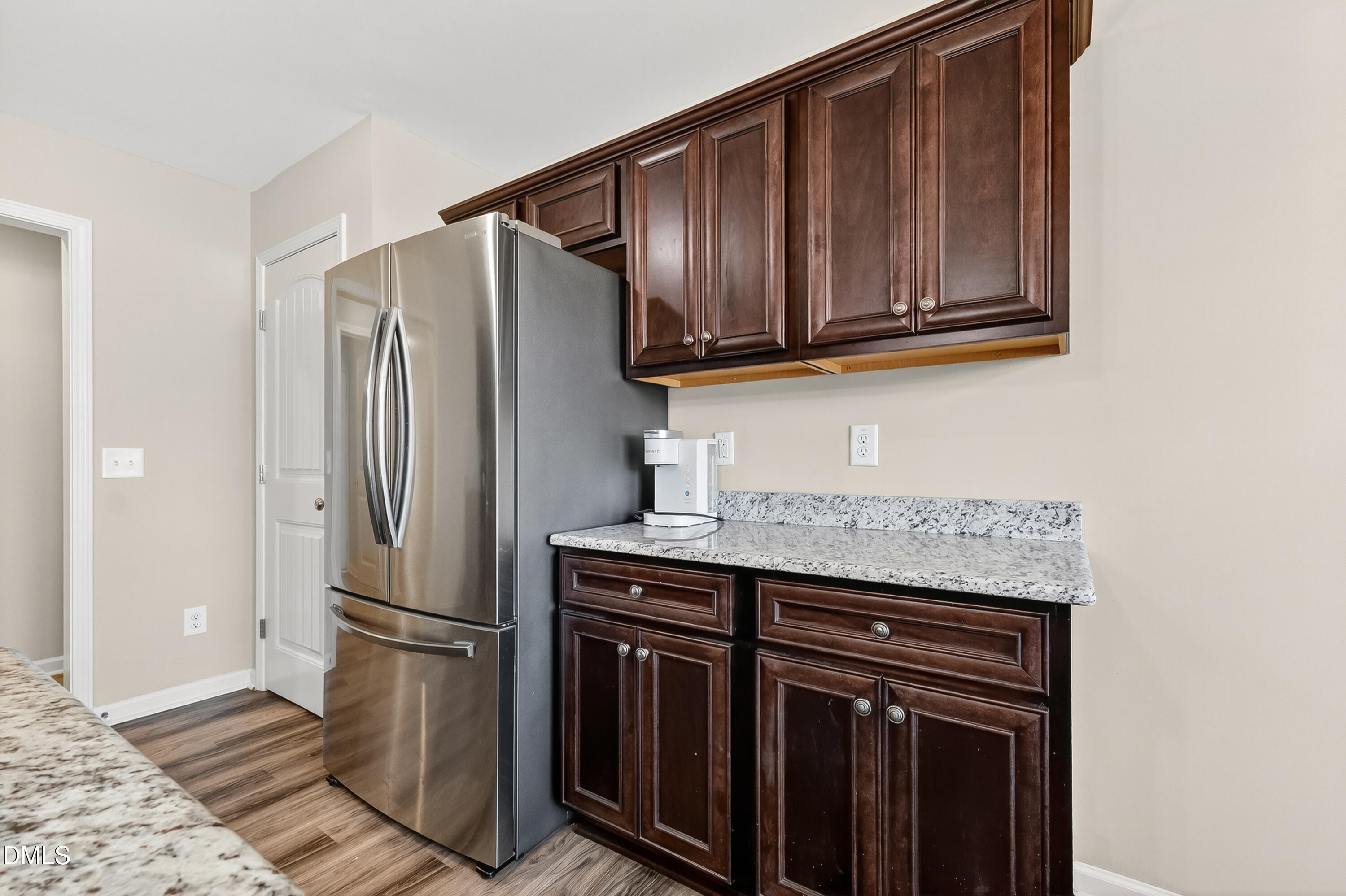 79 Ramble Falls Lane Erwin, NC 28339 - Photo 20 of 46 a kitchen with stainless steel appliances granite countertop a refrigerator and a sink