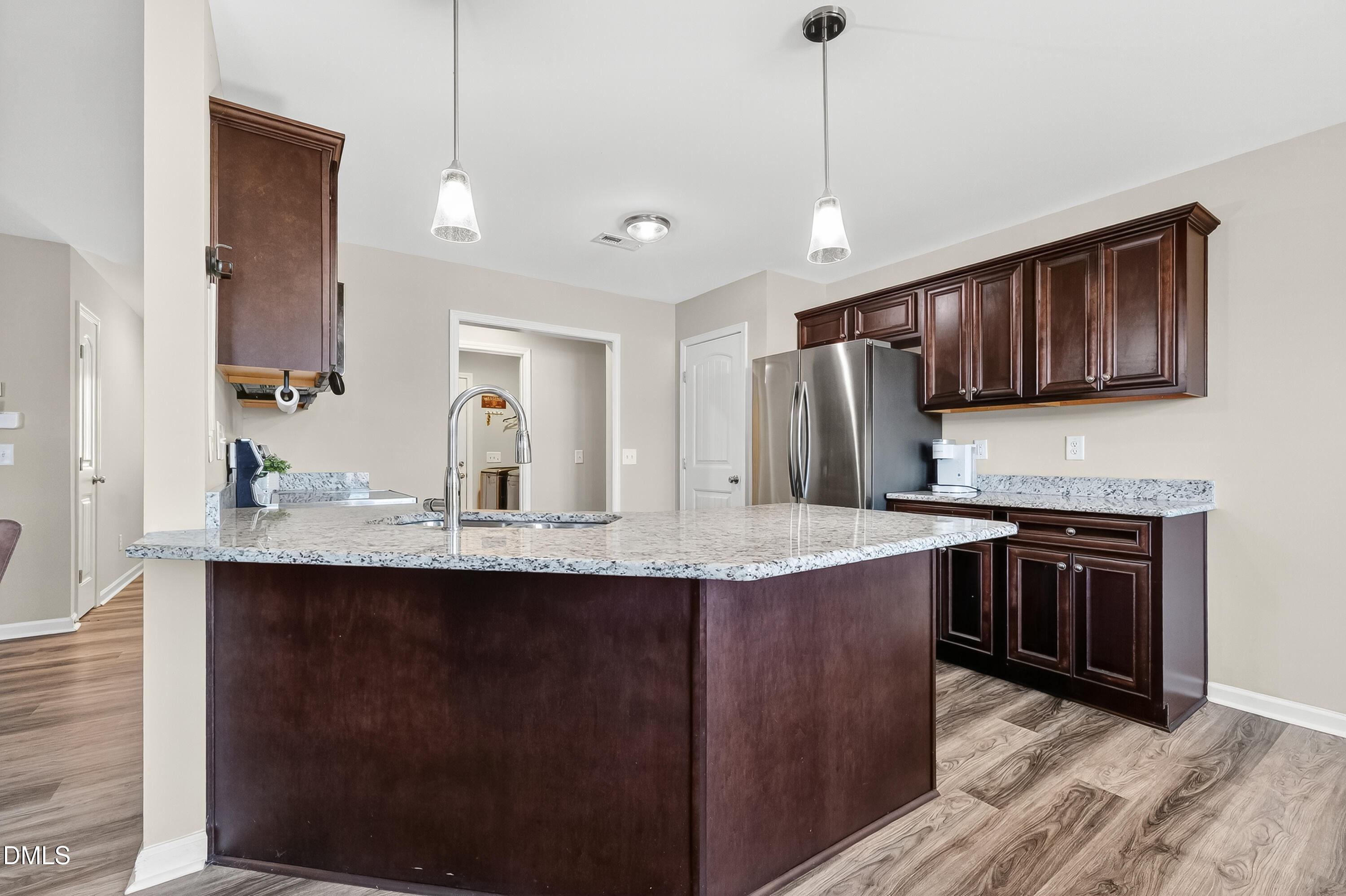 79 Ramble Falls Lane Erwin, NC 28339 - Photo 21 of 46 a kitchen with stainless steel appliances granite countertop a sink stove and cabinets