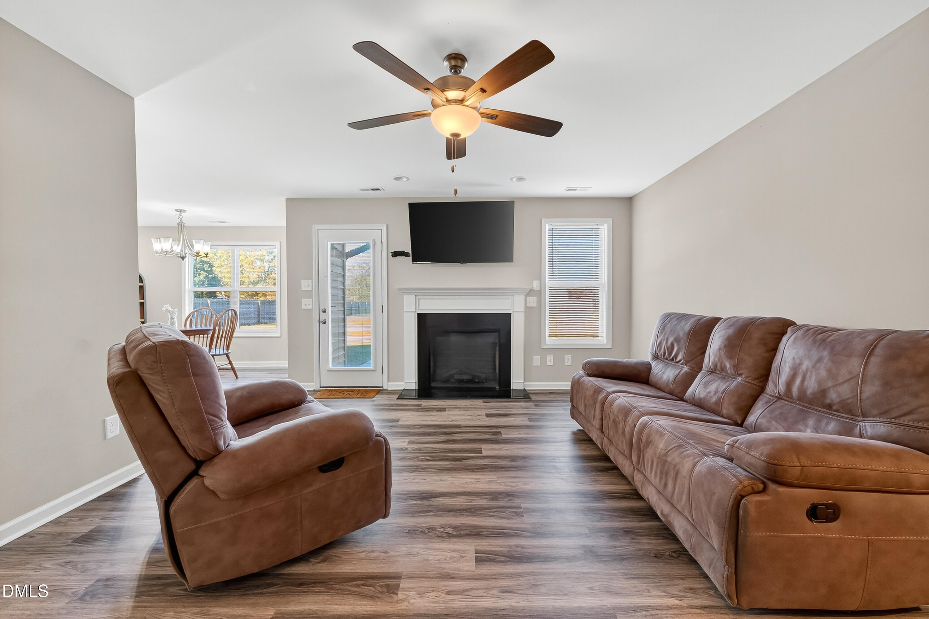 79 Ramble Falls Lane Erwin, NC 28339 - Photo 24 of 46 a living room with furniture and a fireplace