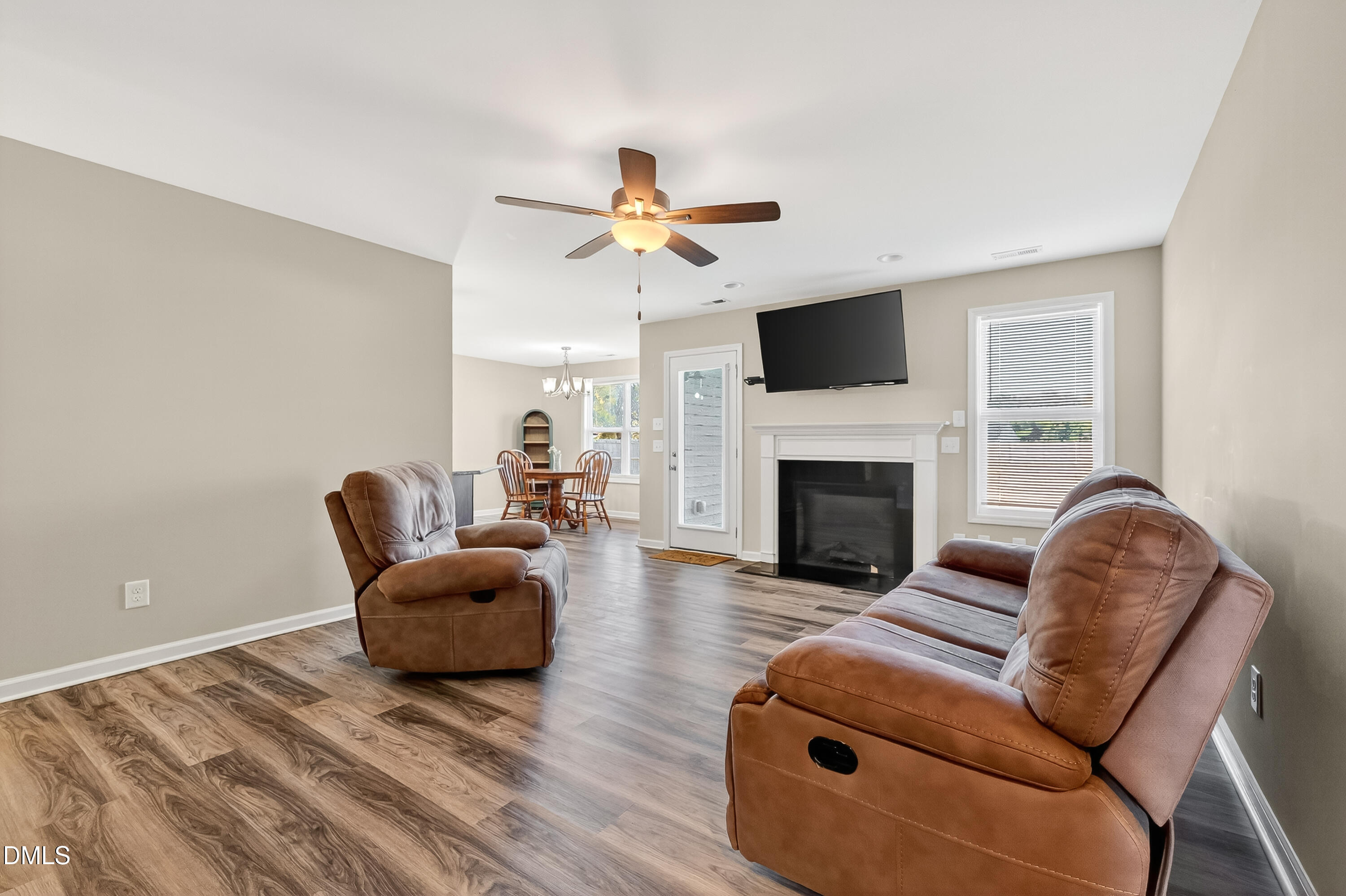 79 Ramble Falls Lane Erwin, NC 28339 - Photo 25 of 46 a living room with furniture a flat screen tv and a fireplace