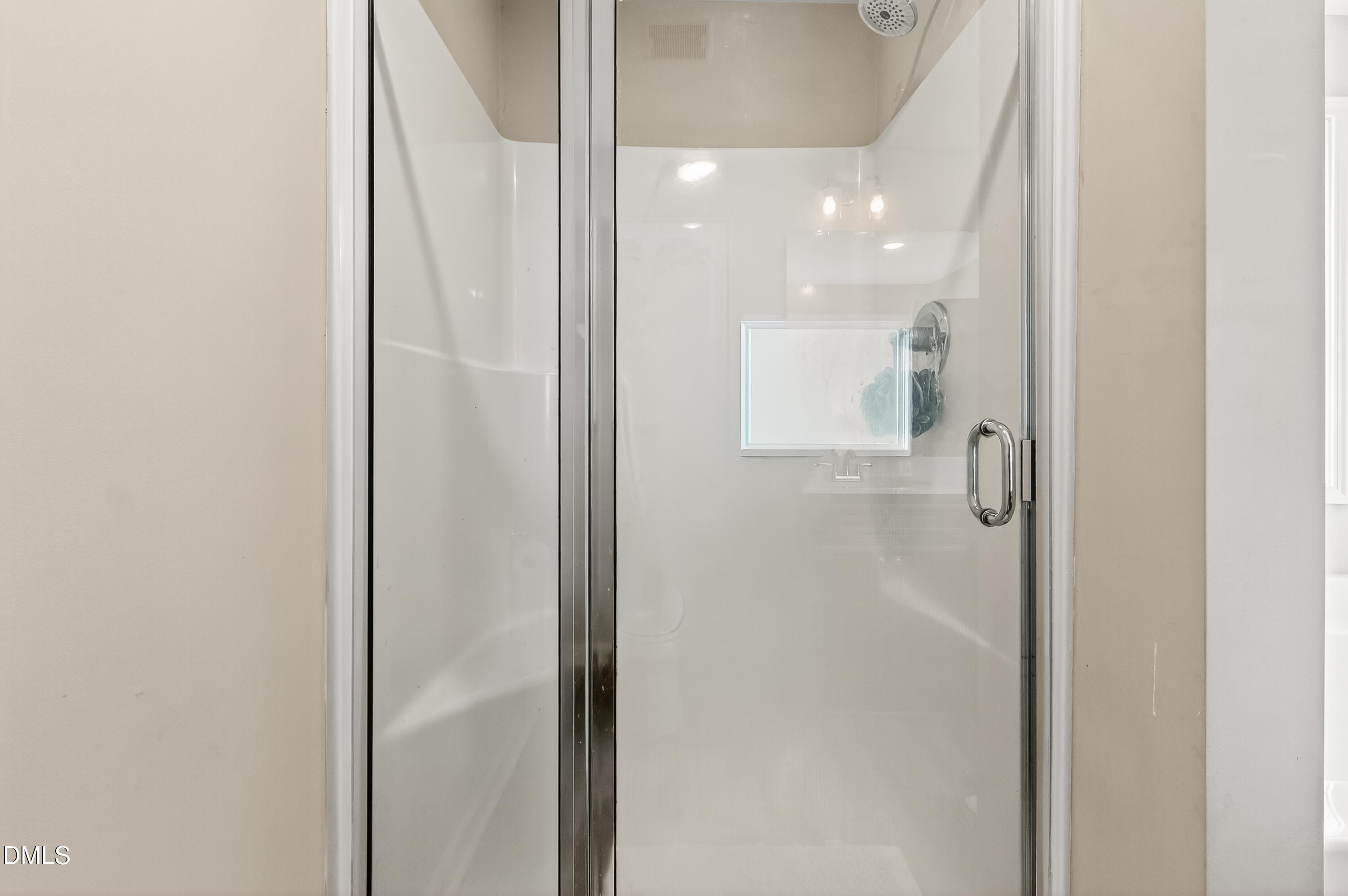 79 Ramble Falls Lane Erwin, NC 28339 - Photo 30 of 46 a bathroom with a glass shower door