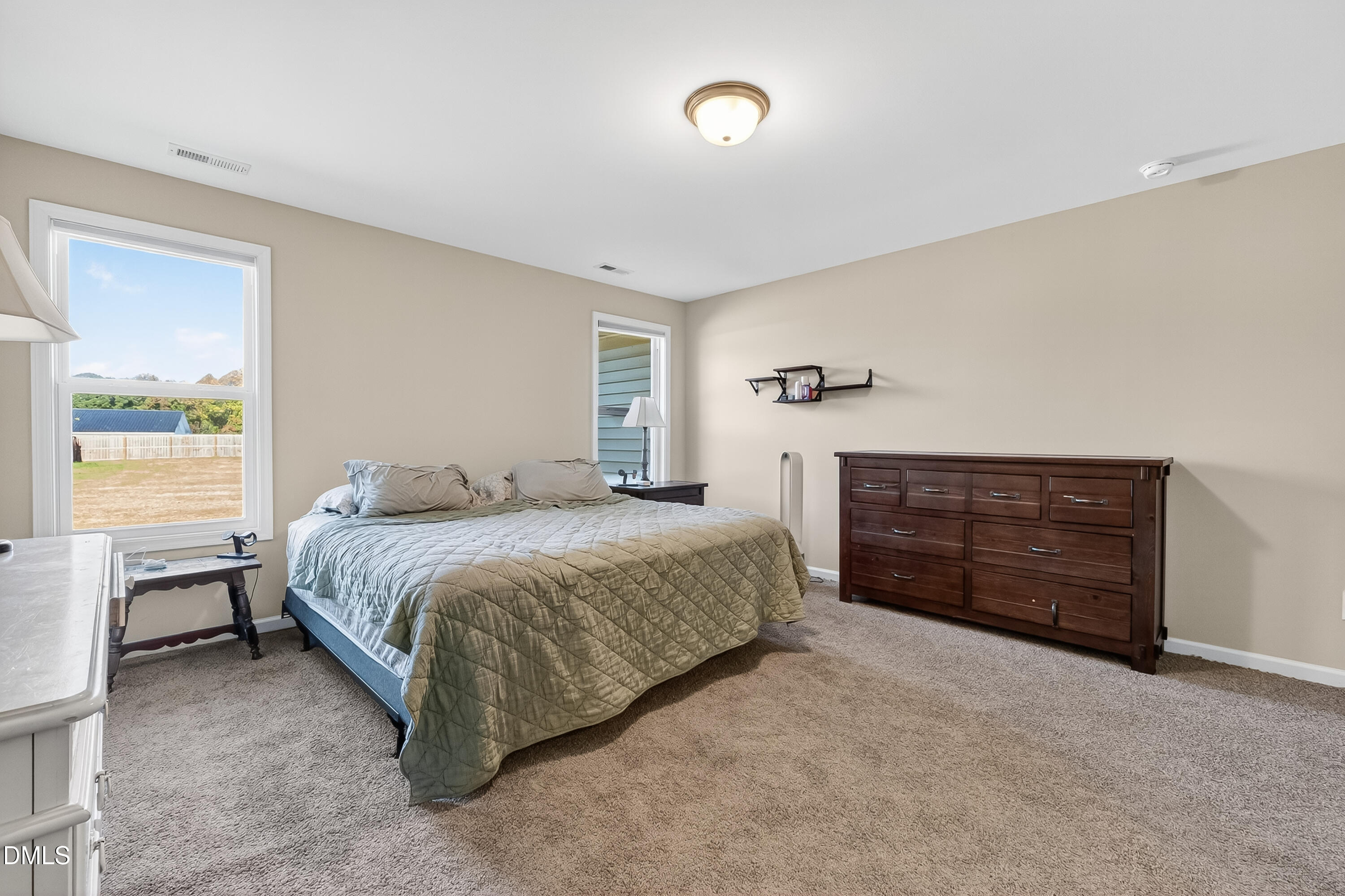 79 Ramble Falls Lane Erwin, NC 28339 - Photo 34 of 46 a spacious bedroom with a bed and a dresser