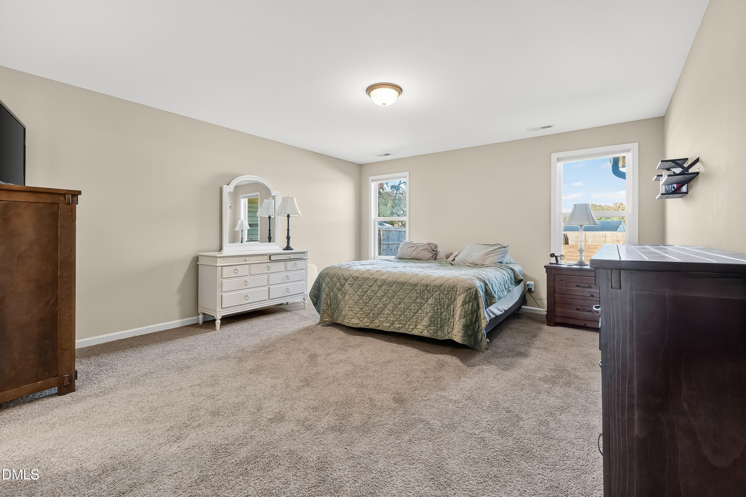 79 Ramble Falls Lane Erwin, NC 28339 - Photo 35 of 46 a spacious bedroom with a bed and a cabinets