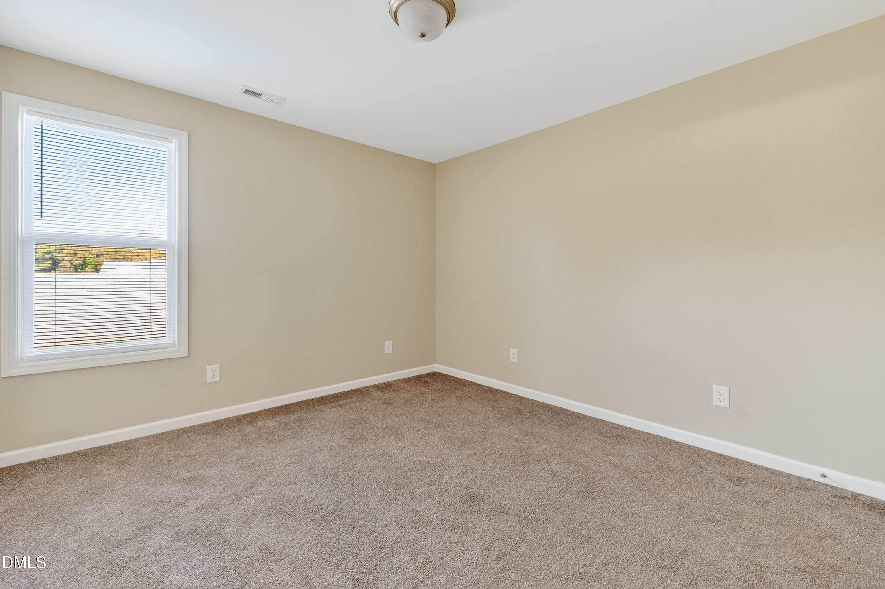 79 Ramble Falls Lane Erwin, NC 28339 - Photo 38 of 46 a view of an empty room with a window