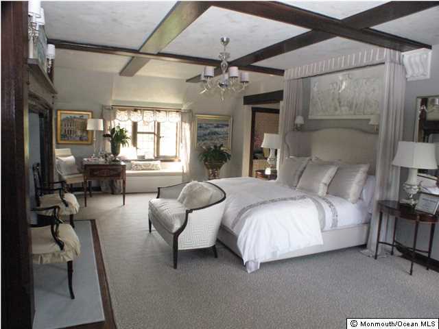 80 Oakes Road Little Silver, NJ 07739 - Photo 14 of 28 a spacious bedroom with a bed couch chandelier and a window