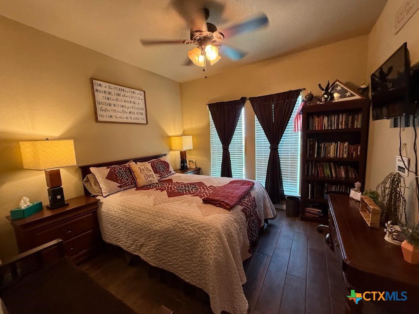 609 Highway 123 Stockdale, TX 78160 - Photo 20 of 26 a bedroom with a bed furniture and a window