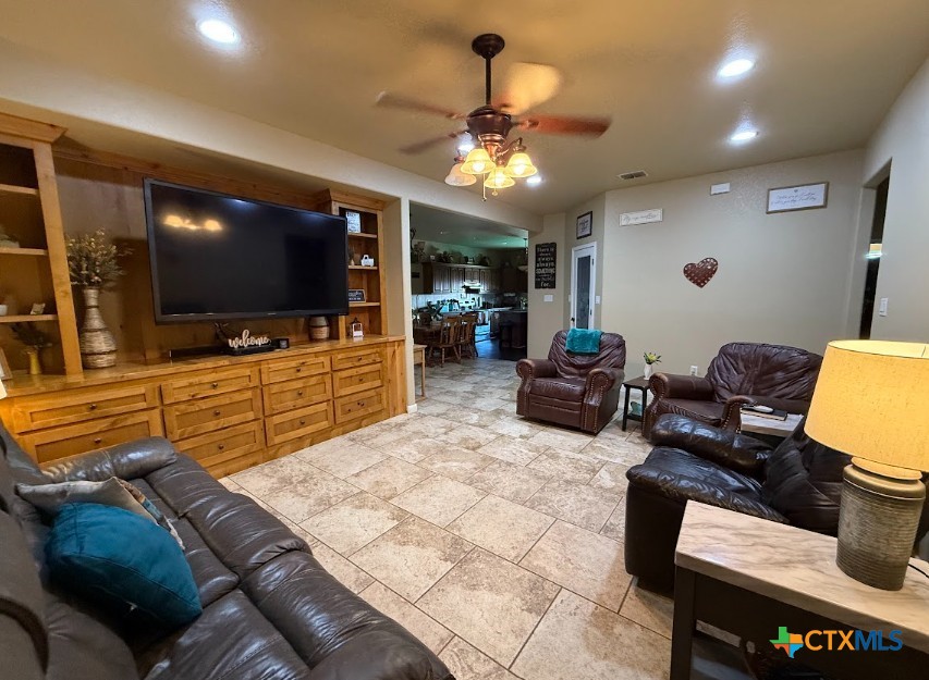 609 Highway 123 Stockdale, TX 78160 - Photo 24 of 26 a living room with furniture and a flat screen tv