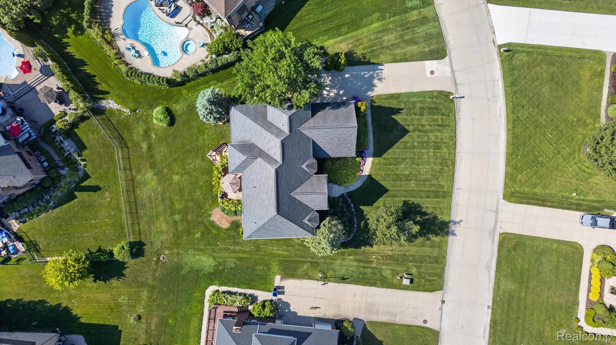 3804 Elk Drive Rochester, MI 48306 - Photo 69 of 75 Aerial perspective highlighting the property's roofline and expansive green lawn