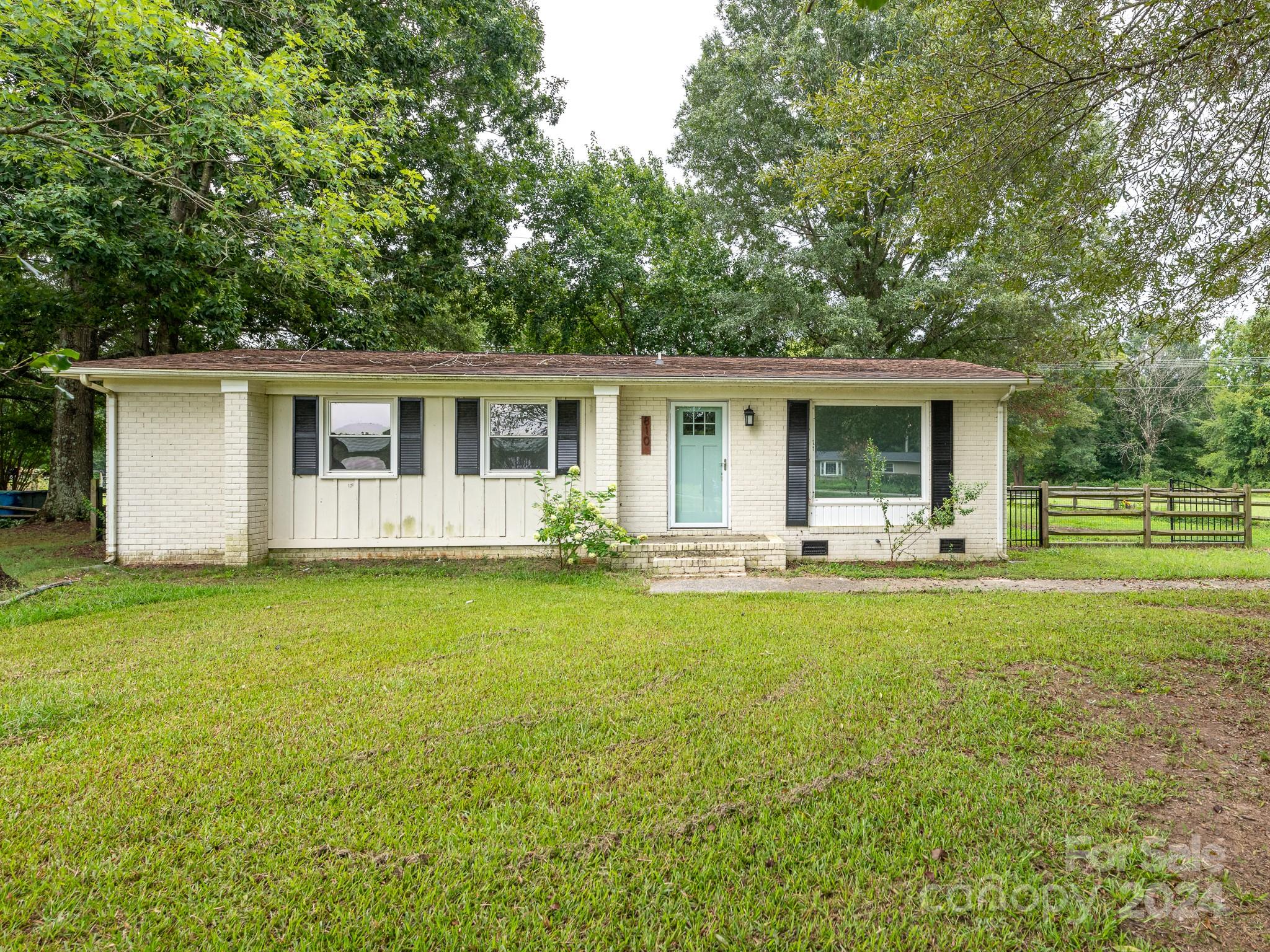 8106 Indian Trail Fairview Road Indian Trail, NC 28079 - Photo 1 of 17 a front view of house with yard and green space