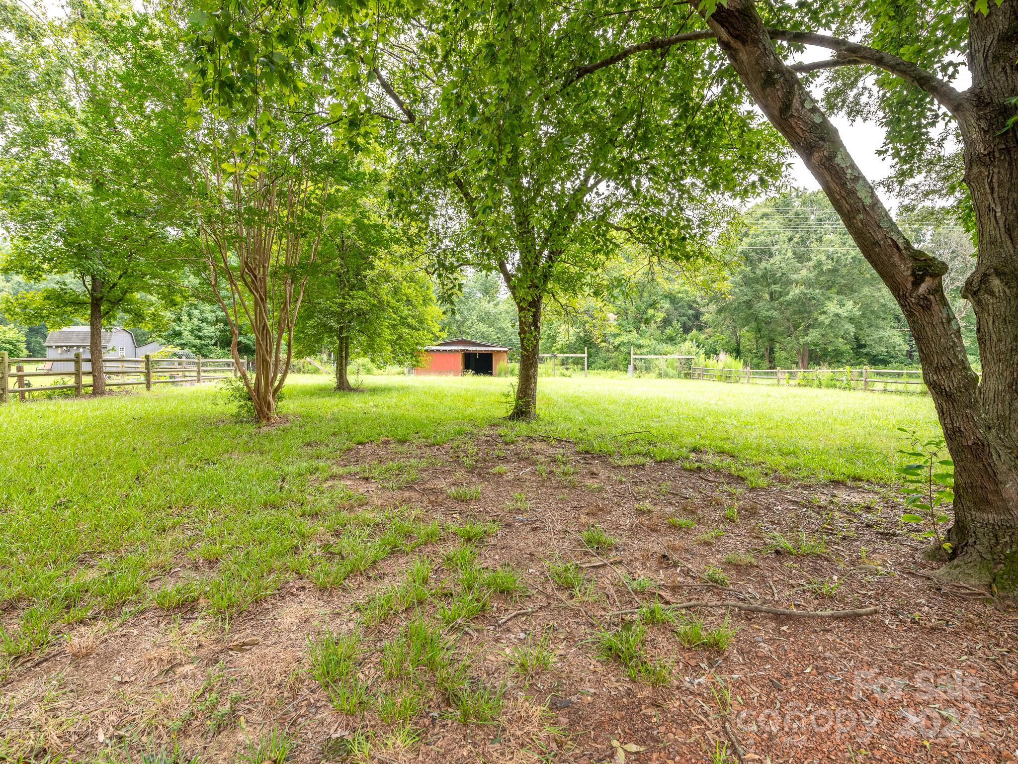 8106 Indian Trail Fairview Road Indian Trail, NC 28079 - Photo 17 of 17 a view of a garden with trees