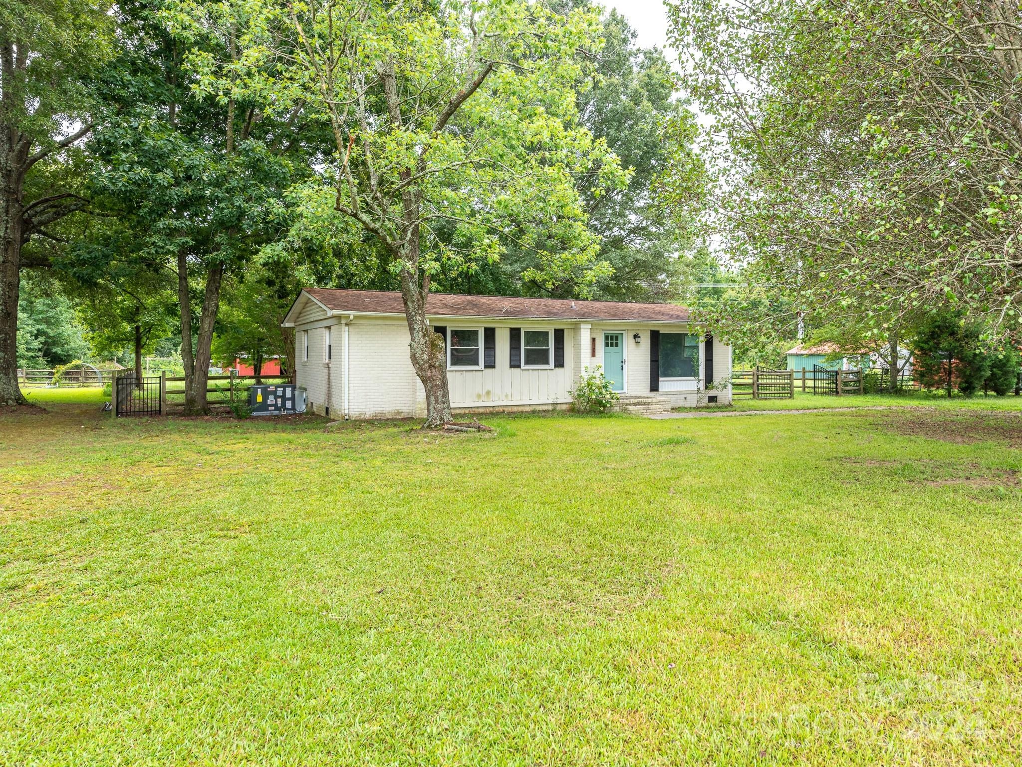 8106 Indian Trail Fairview Road Indian Trail, NC 28079 - Photo 2 of 17 a house view with swimming pool