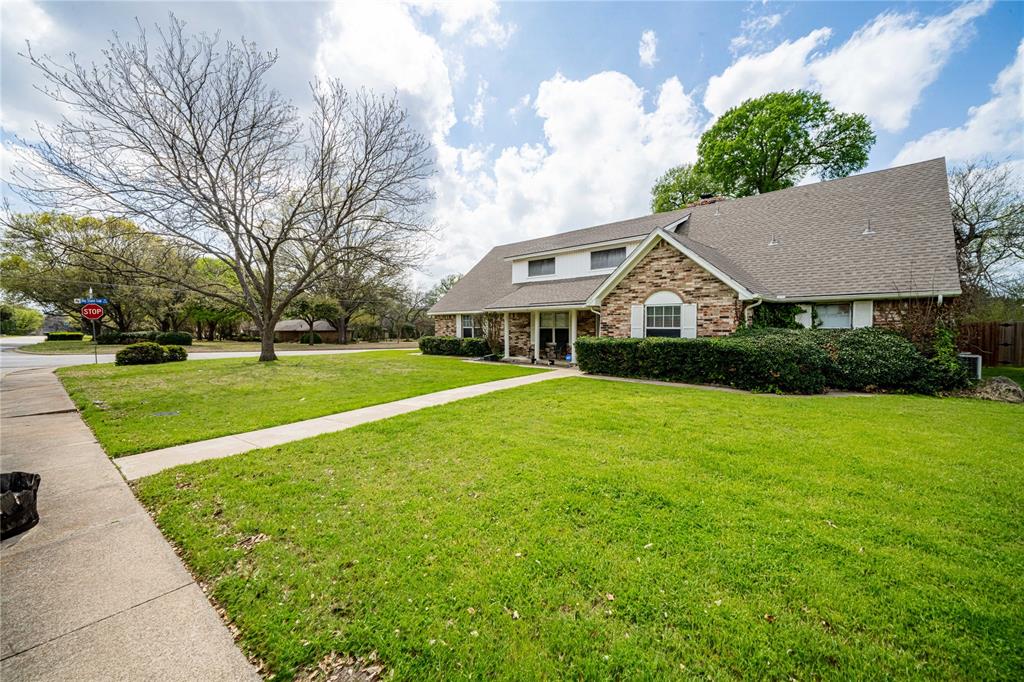 919 Green Hills Road Duncanville, TX 75137 - Photo 2 of 37 View of front facade featuring a front lawn, brick siding, and a shingled roof